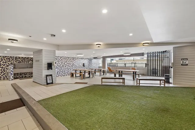 a room with lots of table and chairs