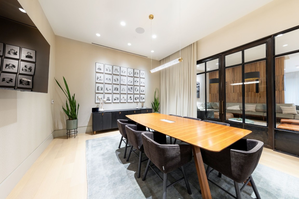 501 West Avenue, Unit 705 Austin, TX 78701 - Photo 24 of 33 a dining room with a table and chairs