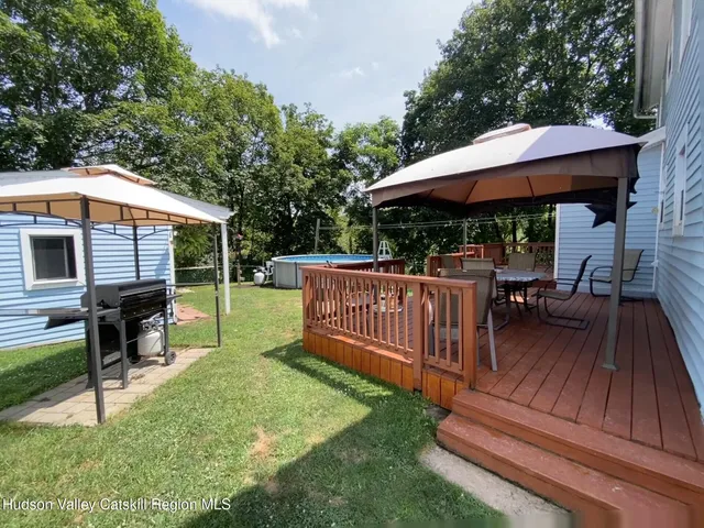 a view of a swimming pool with a yard
