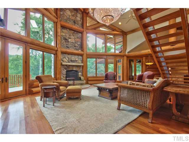 8420 Wake Forest Highway Raleigh, NC 27613 - Photo 4 of 25 Family Room with towering stacked stone fireplace and lots of nature light Den/Family/Great Room