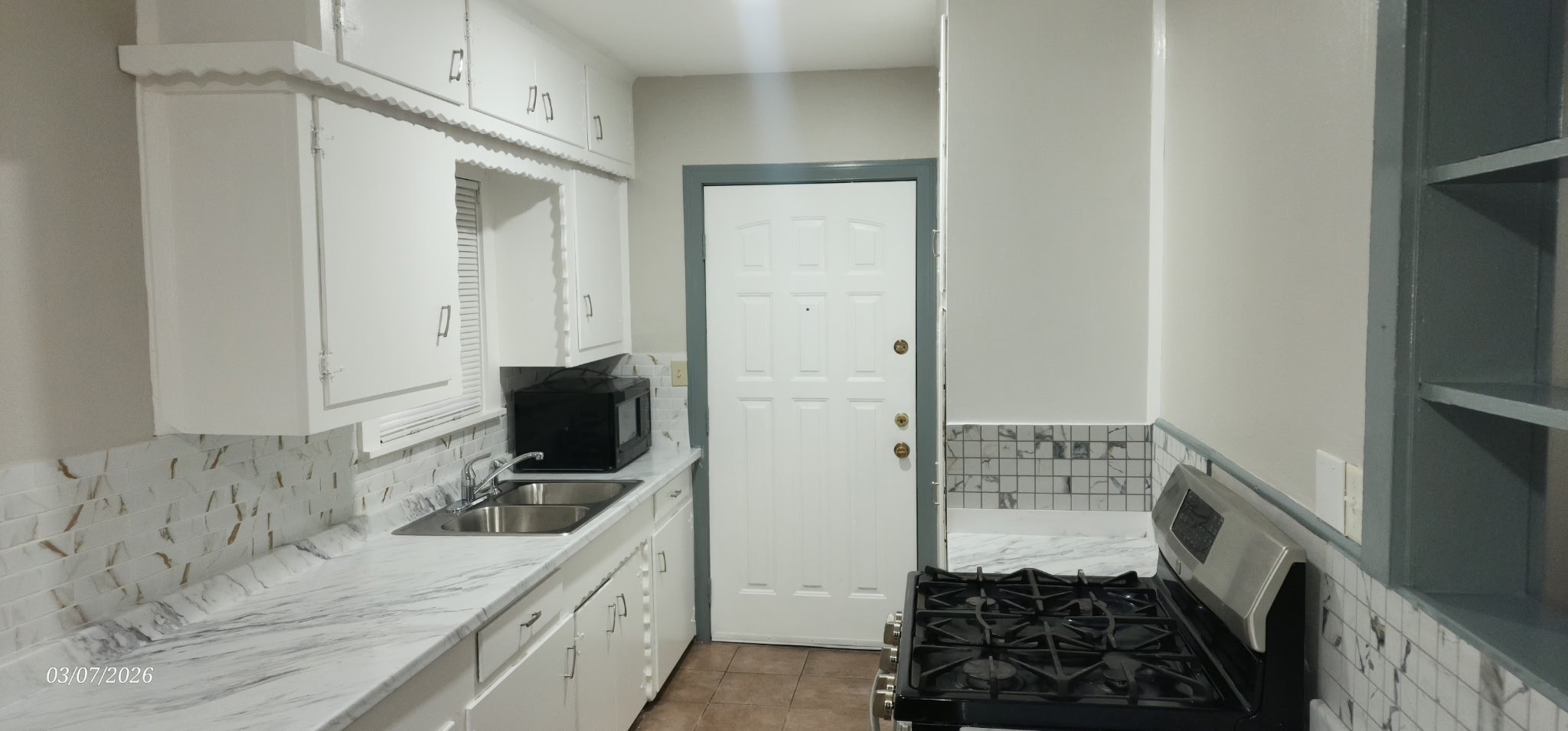 4612 Hain Street Houston, TX 77009 - Photo 13 of 21 a kitchen with sink stove and refrigerator
