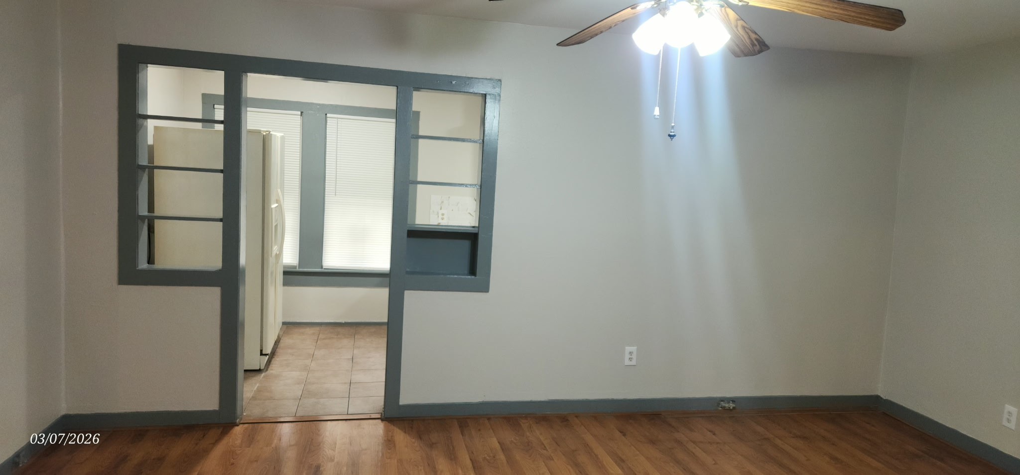 4612 Hain Street Houston, TX 77009 - Photo 14 of 21 an empty room with wooden floor fan and windows