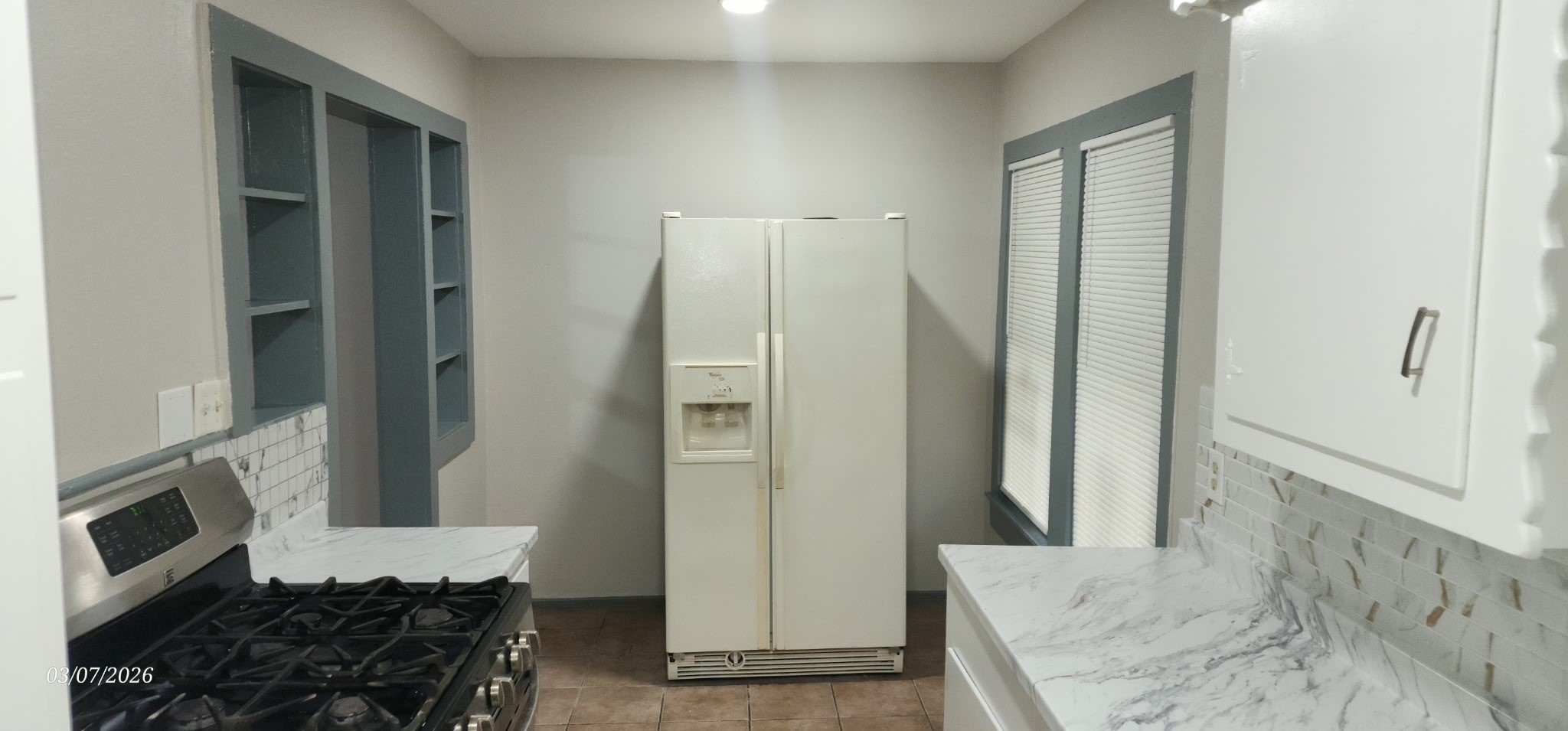 4612 Hain Street Houston, TX 77009 - Photo 16 of 21 a kitchen with stainless steel appliances granite countertop a refrigerator and a stove