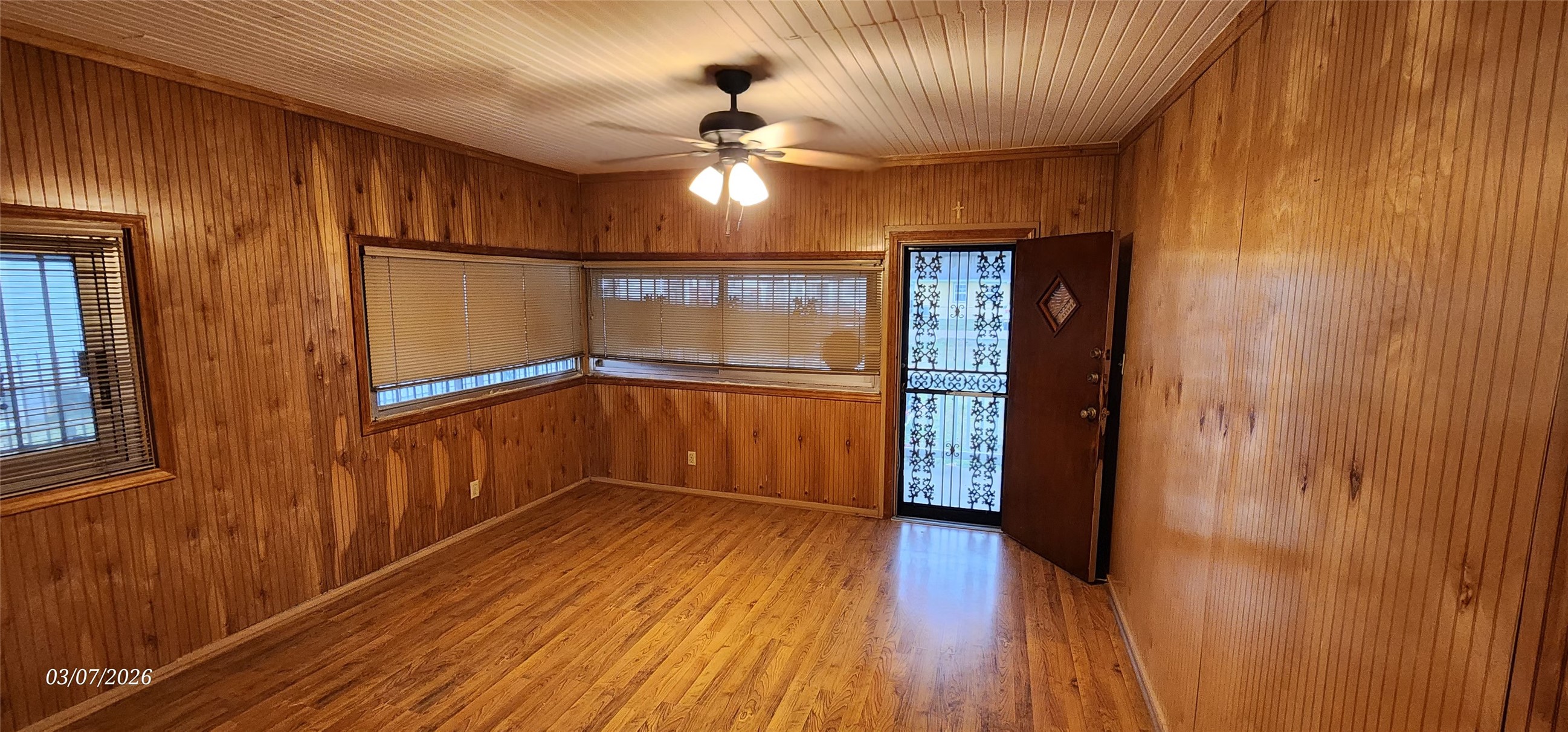 4612 Hain Street Houston, TX 77009 - Photo 3 of 21 wooden floor in an empty room with a window