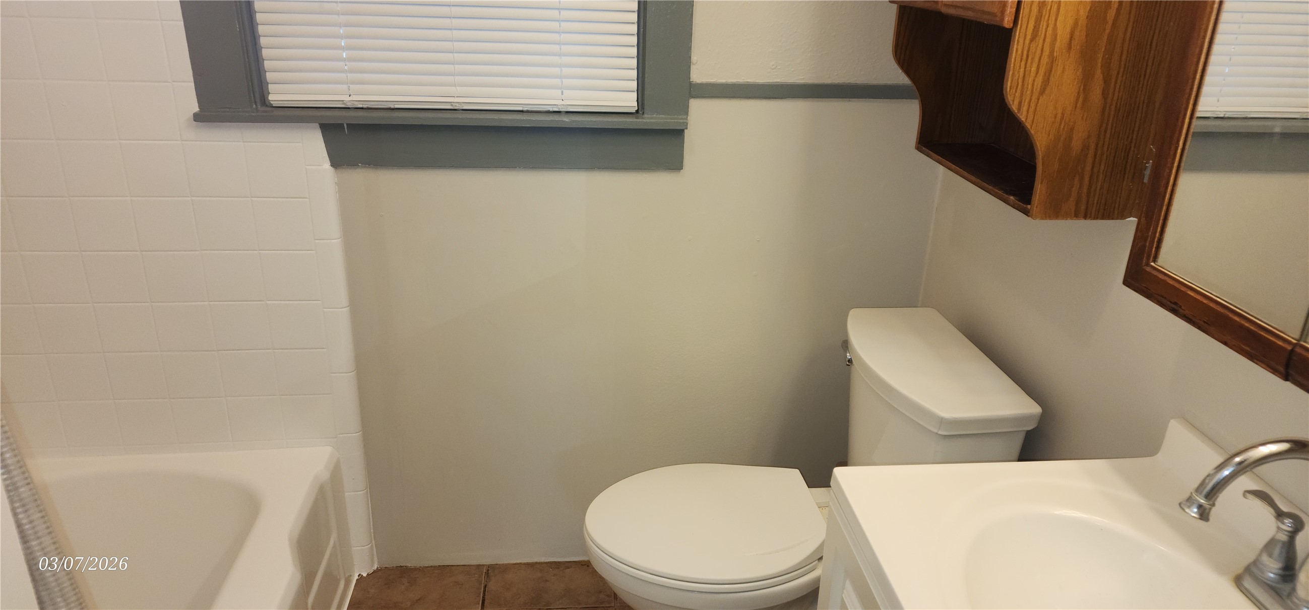 4612 Hain Street Houston, TX 77009 - Photo 6 of 21 a white toilet sitting next to a bathroom sink