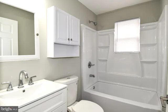 a bathroom with a sink toilet and bathtub