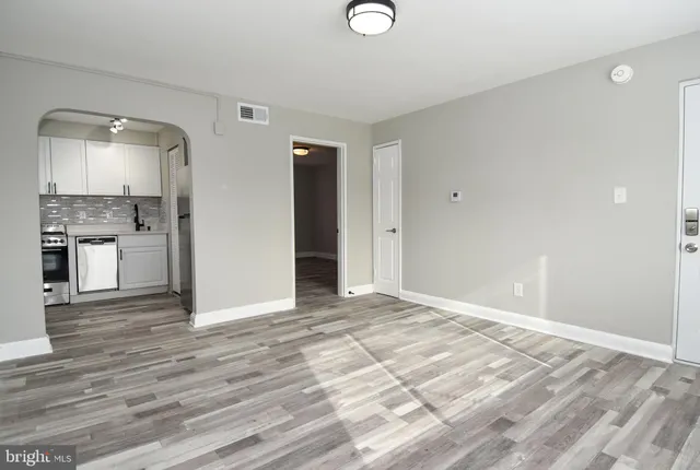 a view of a livingroom with wooden floor
