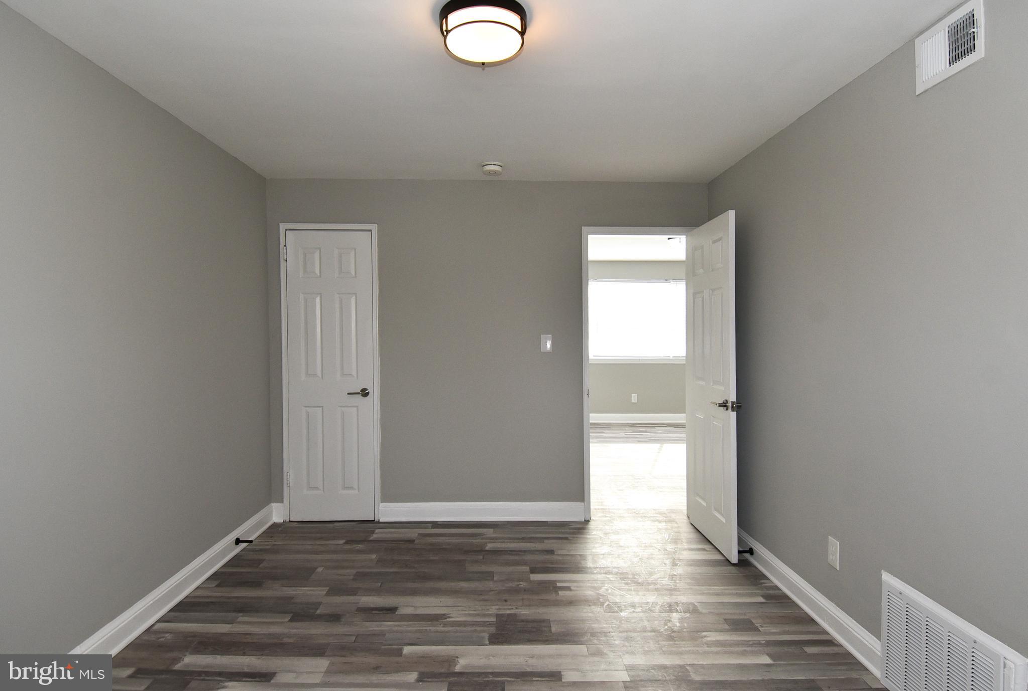 8208 Bellefonte Lane, Unit 3 Clinton, MD 20735 - Photo 23 of 38 a view of empty room with wooden floor