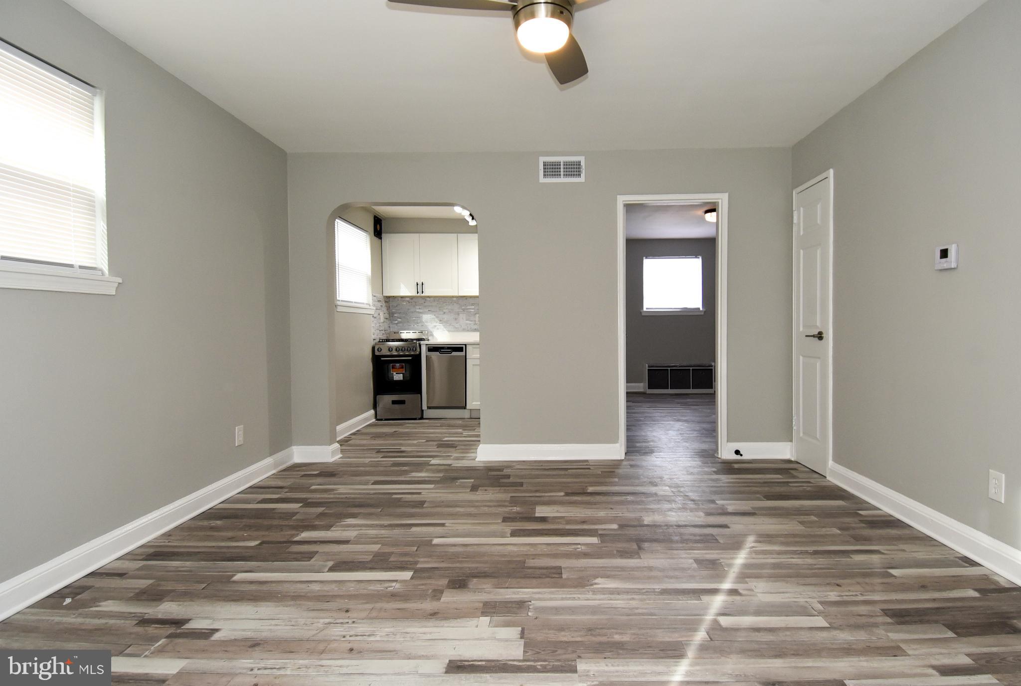 8208 Bellefonte Lane, Unit 3 Clinton, MD 20735 - Photo 5 of 38 a view of empty room with wooden floor and fan