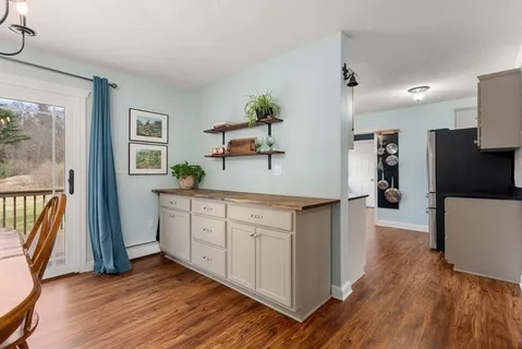 a view of a kitchen counter space and wooden floor