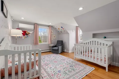 a bedroom with furniture and a window
