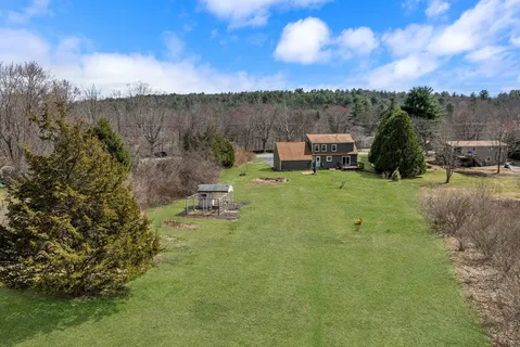 a view of a lake with a yard