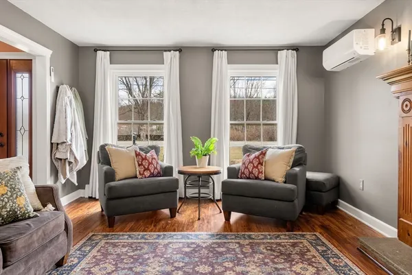 a view of a porch with furniture and a window