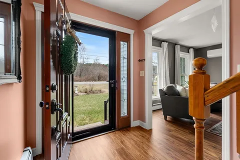 a view of a porch with furniture and a window
