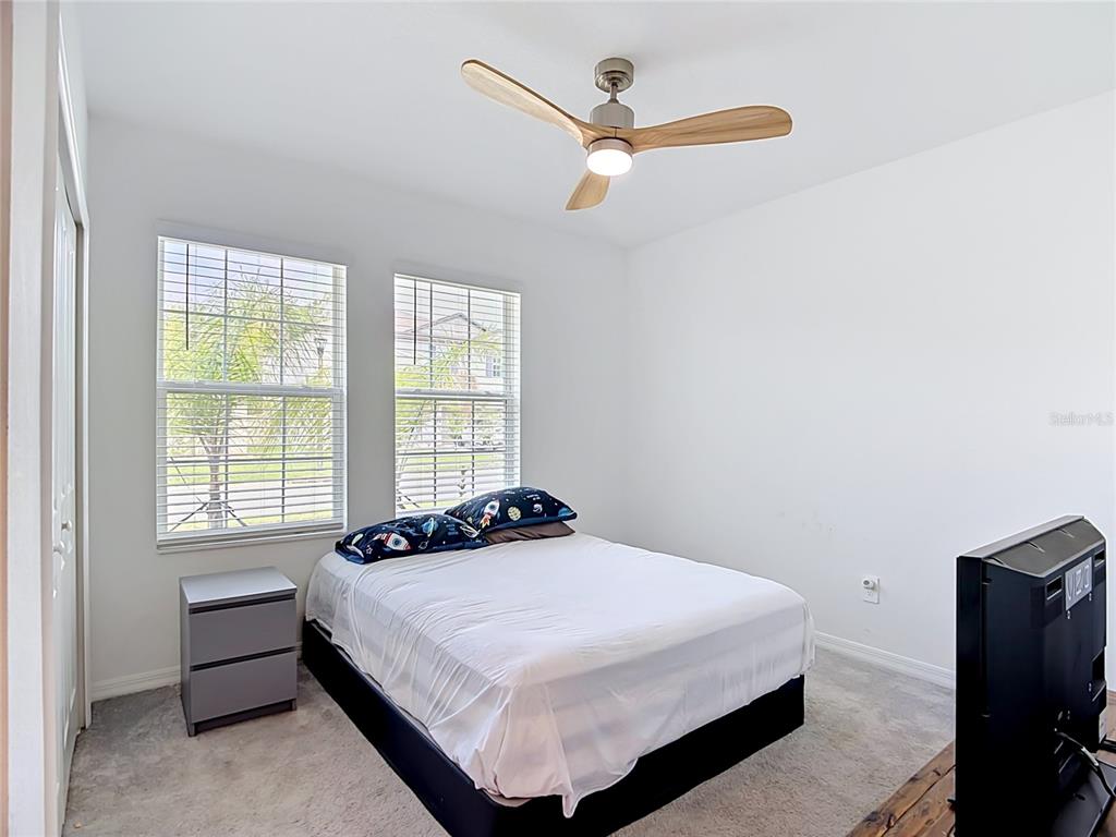 1633 Red Loop Lakeland, FL 33801 - Photo 15 of 60 a bedroom with a bed and a window