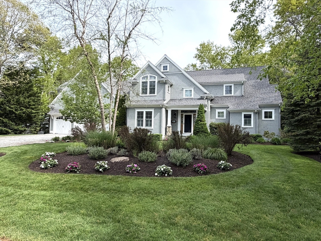 4 Tamarack Lane Sandwich, MA 02563 - Photo 1 of 42 a front view of house with yard and trees