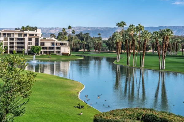 a view of a lake with a building in front of it