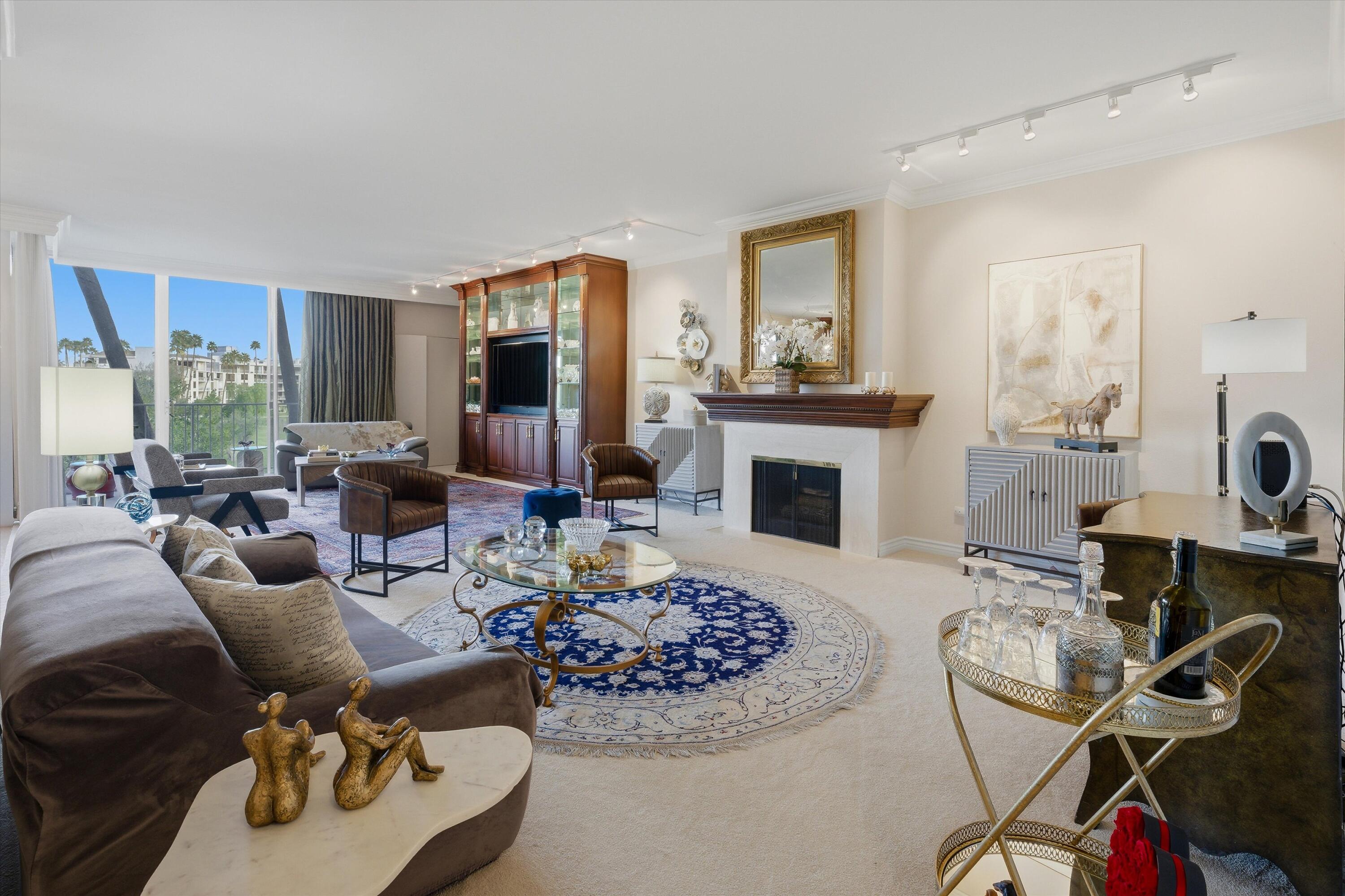 900 Island Drive, Unit 304 Rancho Mirage, CA 92270 - Photo 12 of 40 a living room with furniture and a fireplace