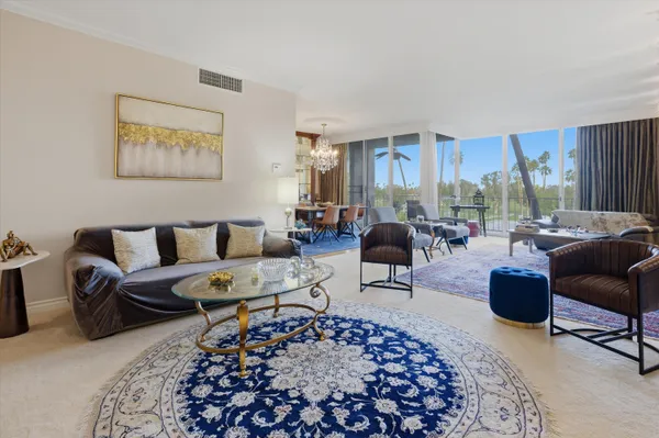 a living room with furniture and a rug