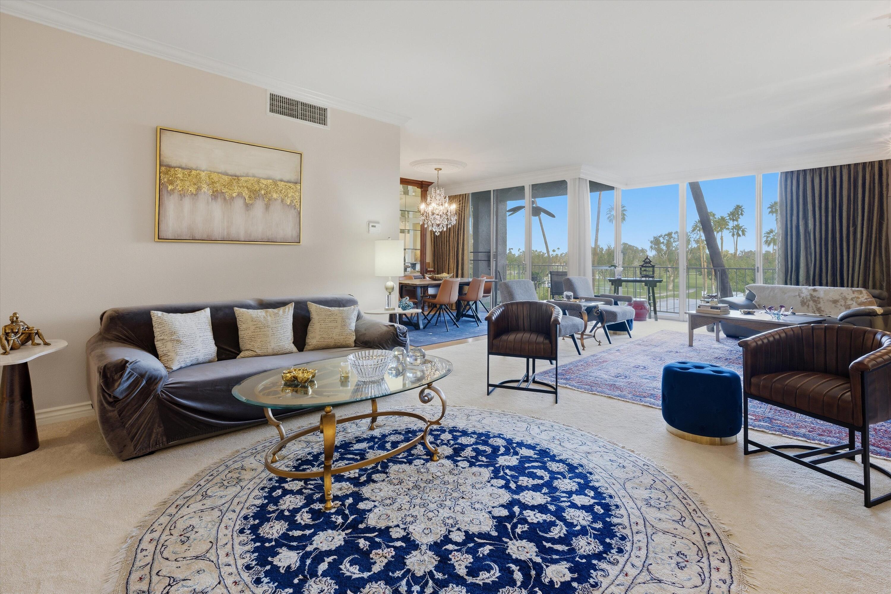 900 Island Drive, Unit 304 Rancho Mirage, CA 92270 - Photo 13 of 40 a living room with furniture and a rug