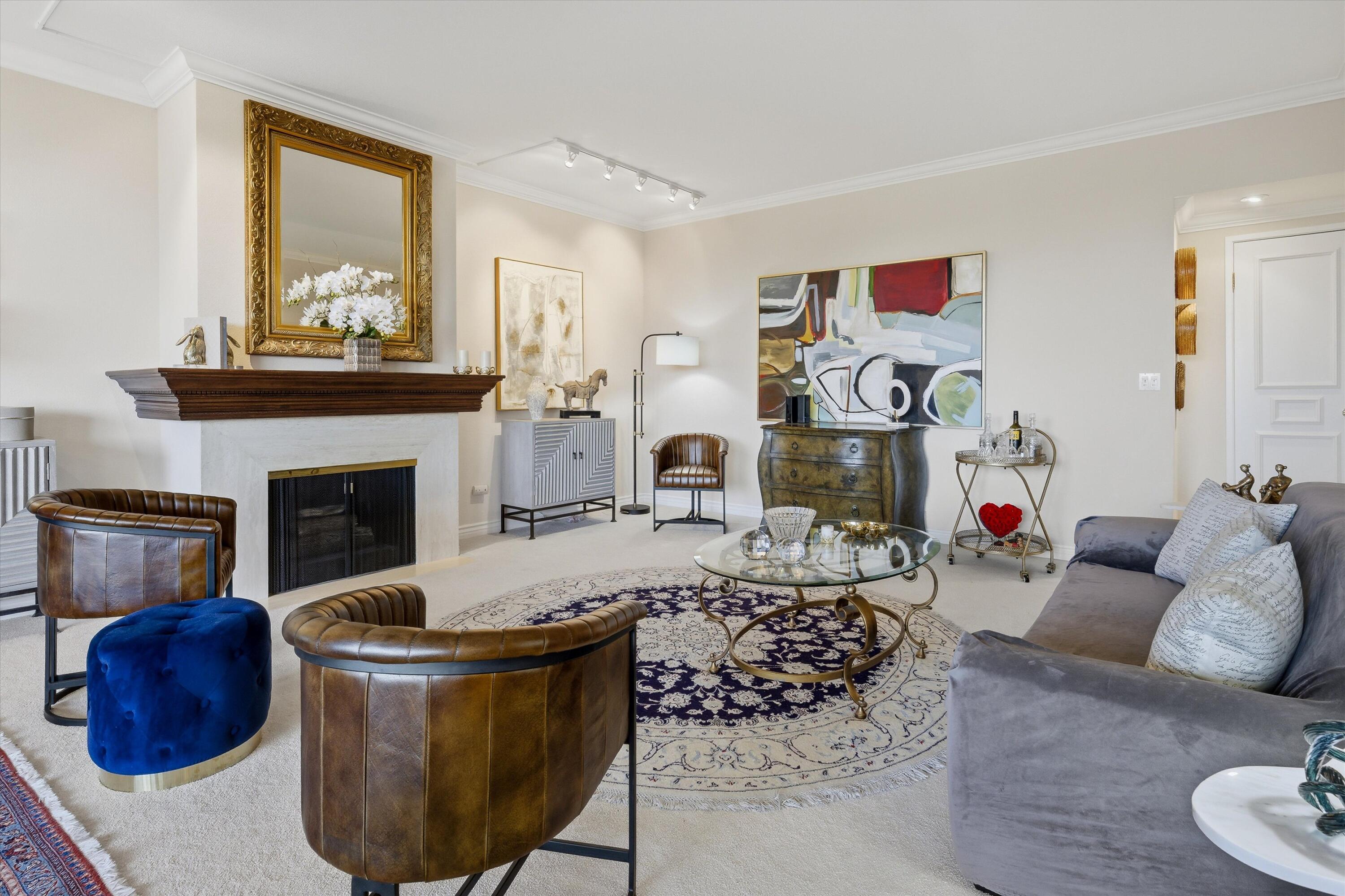 900 Island Drive, Unit 304 Rancho Mirage, CA 92270 - Photo 14 of 40 a living room with furniture and a fireplace