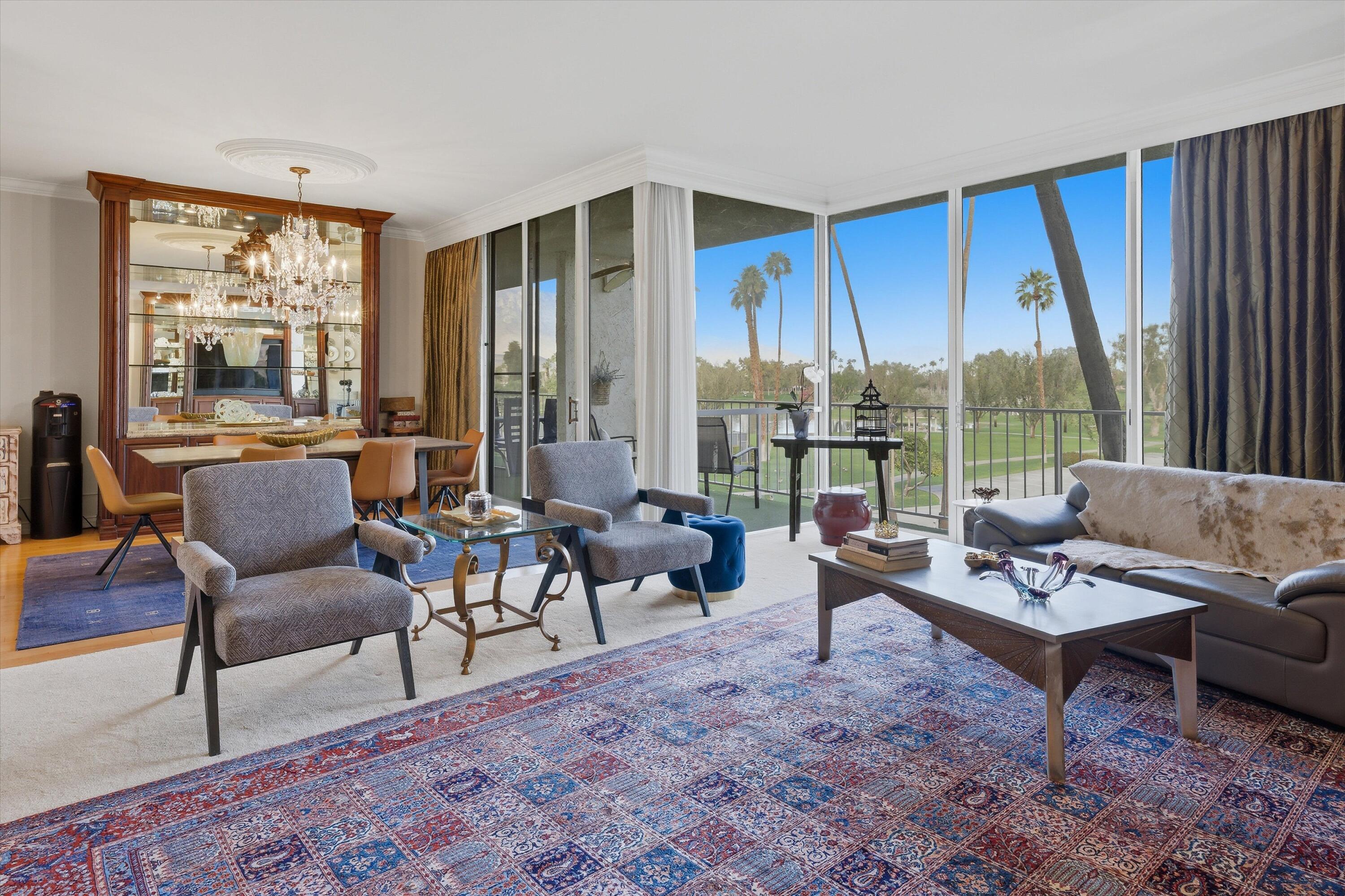 900 Island Drive, Unit 304 Rancho Mirage, CA 92270 - Photo 16 of 40 a living room with furniture and a large window
