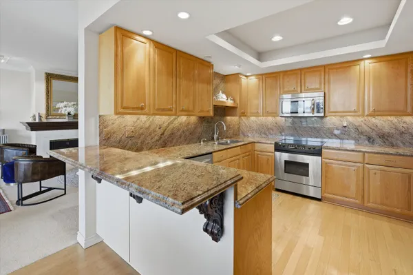 a kitchen with a stove a sink and a refrigerator