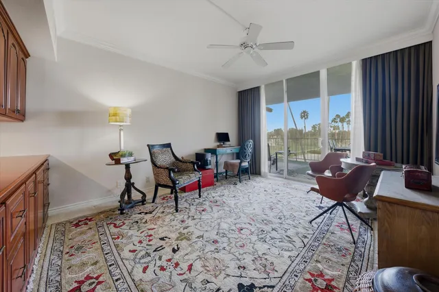 a living room with furniture a rug and a window