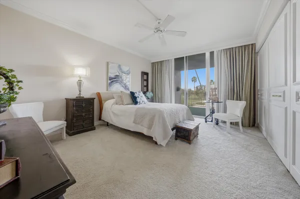 a spacious bedroom with a bed and a couch
