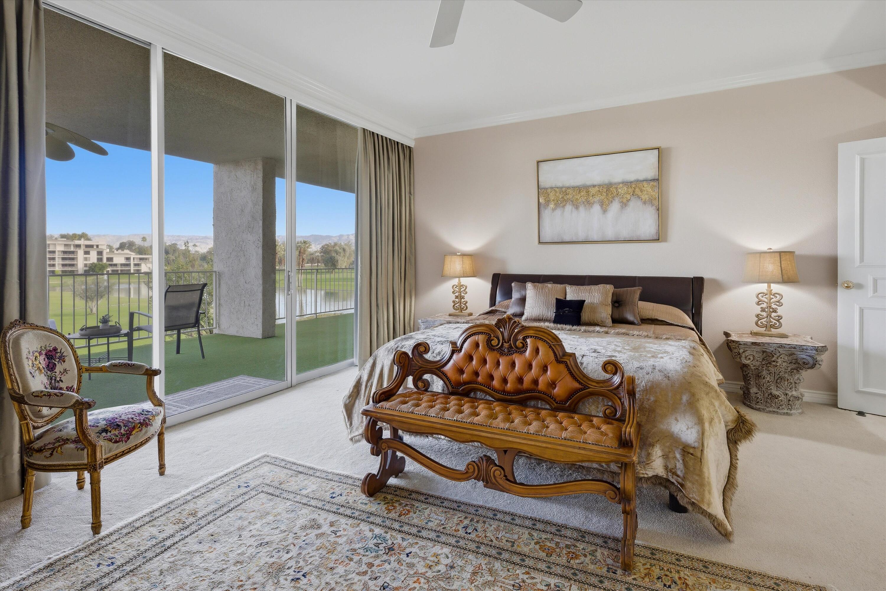 900 Island Drive, Unit 304 Rancho Mirage, CA 92270 - Photo 31 of 40 a bedroom with a bed and a window