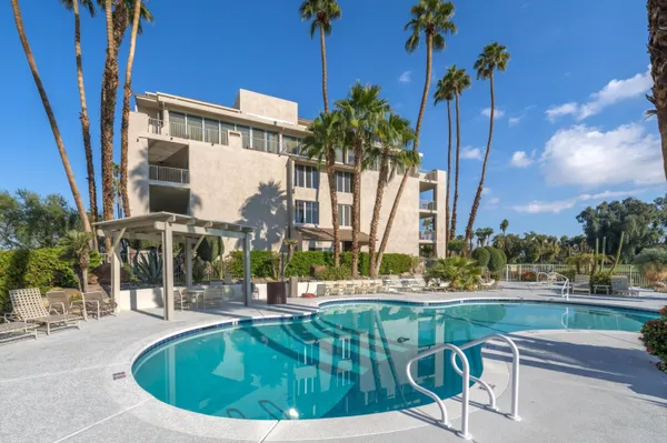 a view of a swimming pool with a patio