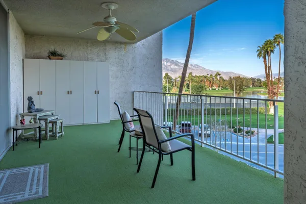 a view of a chairs and table in patio