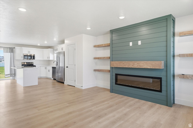 730 West 500 North Smithfield, UT 84335 - Photo 7 of 46 Open-concept living space with light wood-finish flooring