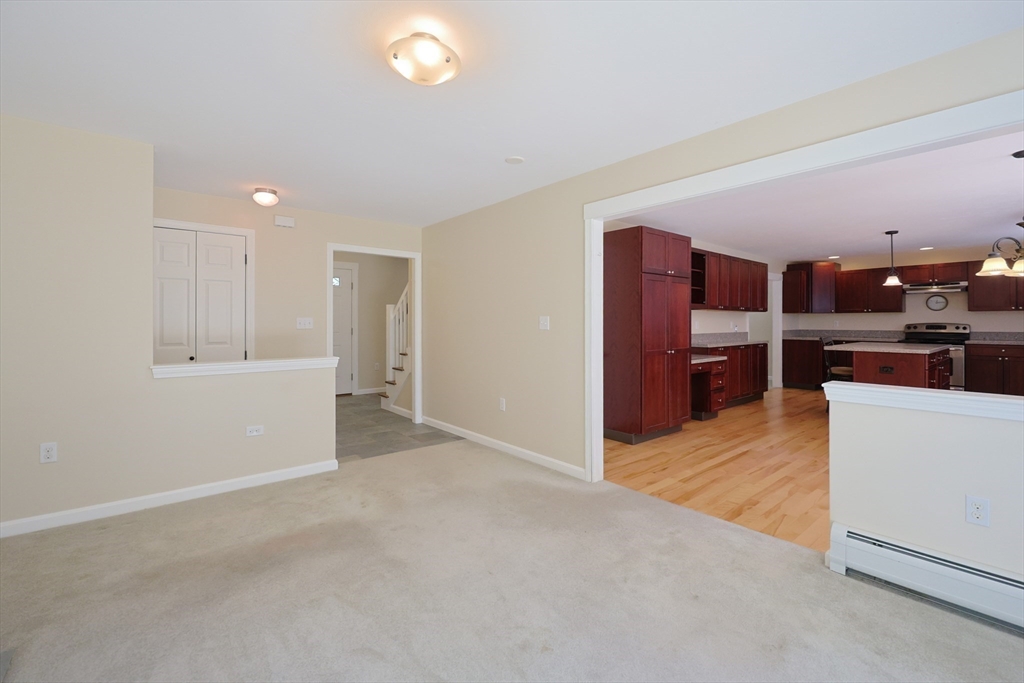 68 Dresser Hill Road, Unit 2 Dudley, MA 01571 - Photo 14 of 39 a view of kitchen and kitchen with furniture