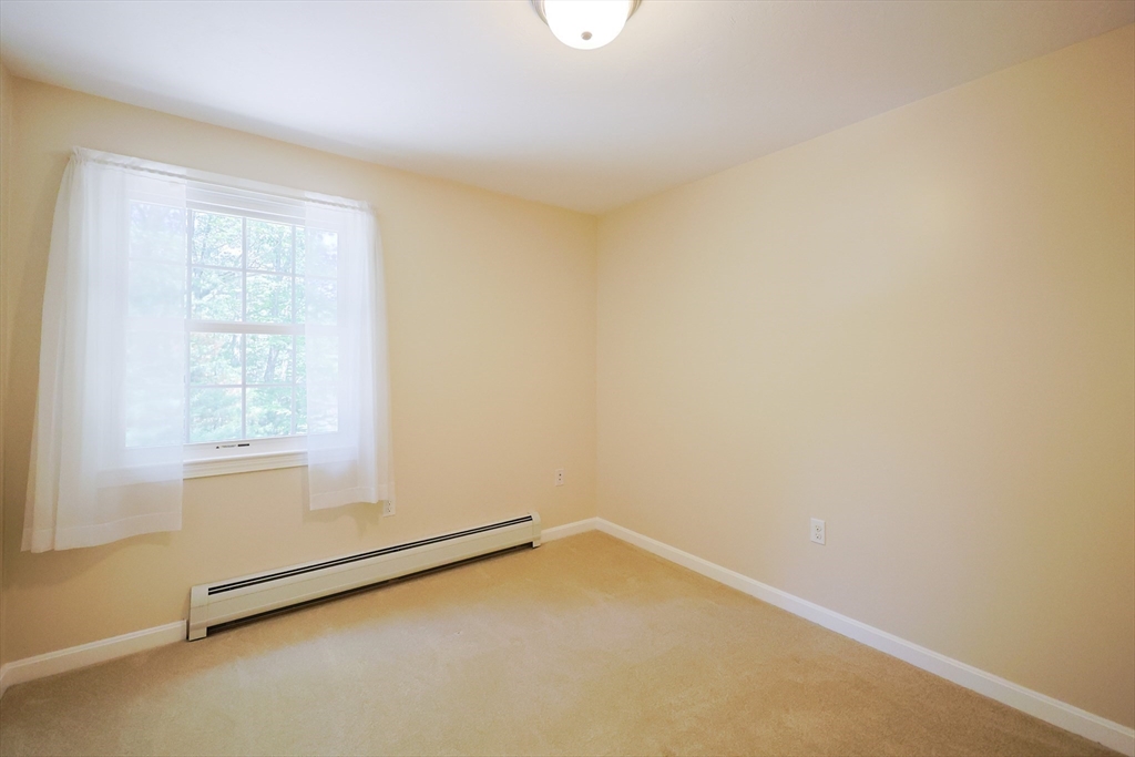 68 Dresser Hill Road, Unit 2 Dudley, MA 01571 - Photo 23 of 39 an empty room with a window