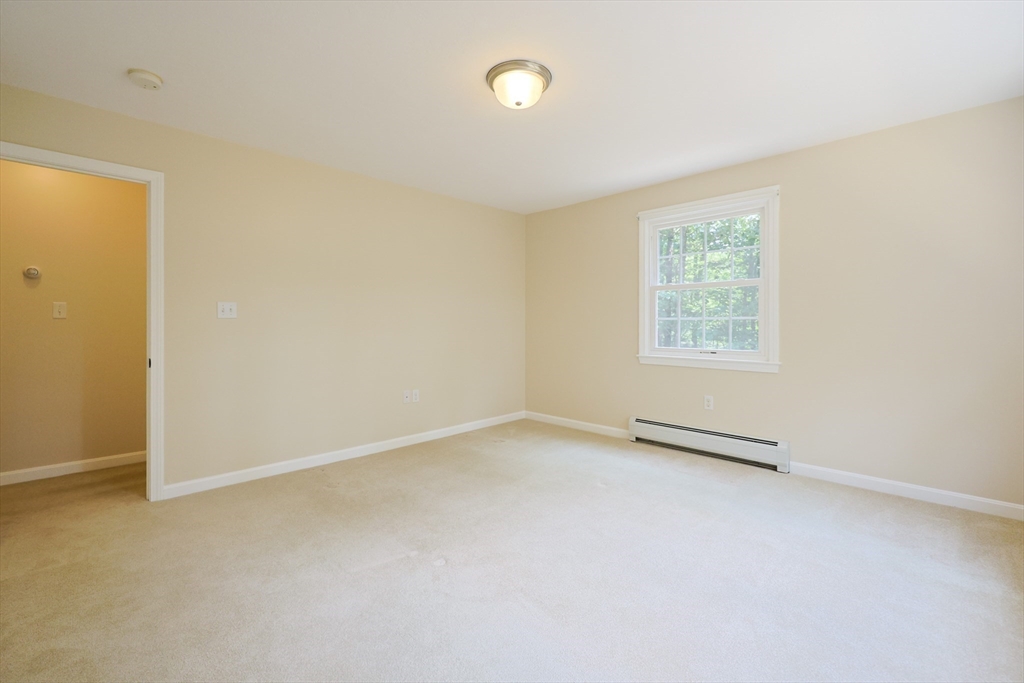 68 Dresser Hill Road, Unit 2 Dudley, MA 01571 - Photo 28 of 39 an empty room with windows