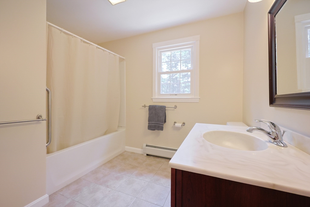 68 Dresser Hill Road, Unit 2 Dudley, MA 01571 - Photo 30 of 39 a bathroom with a sink and a bathtub