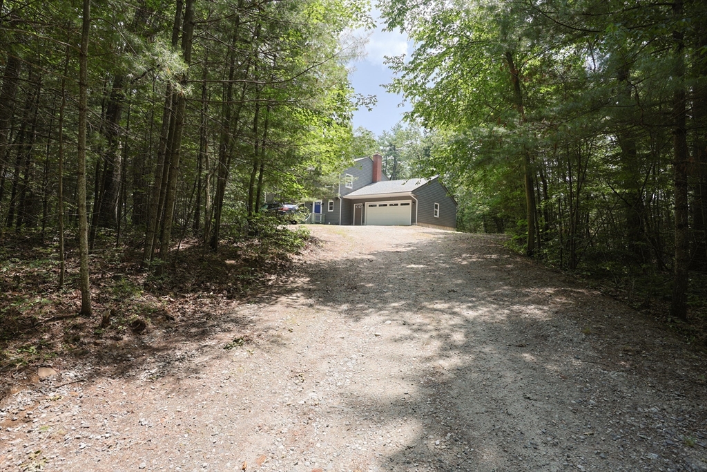 68 Dresser Hill Road, Unit 2 Dudley, MA 01571 - Photo 3 of 39 a view of a house with a yard