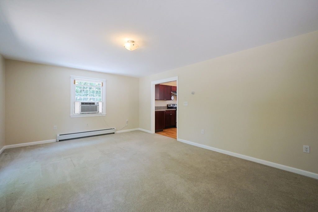 68 Dresser Hill Road, Unit 2 Dudley, MA 01571 - Photo 31 of 39 an empty room with windows
