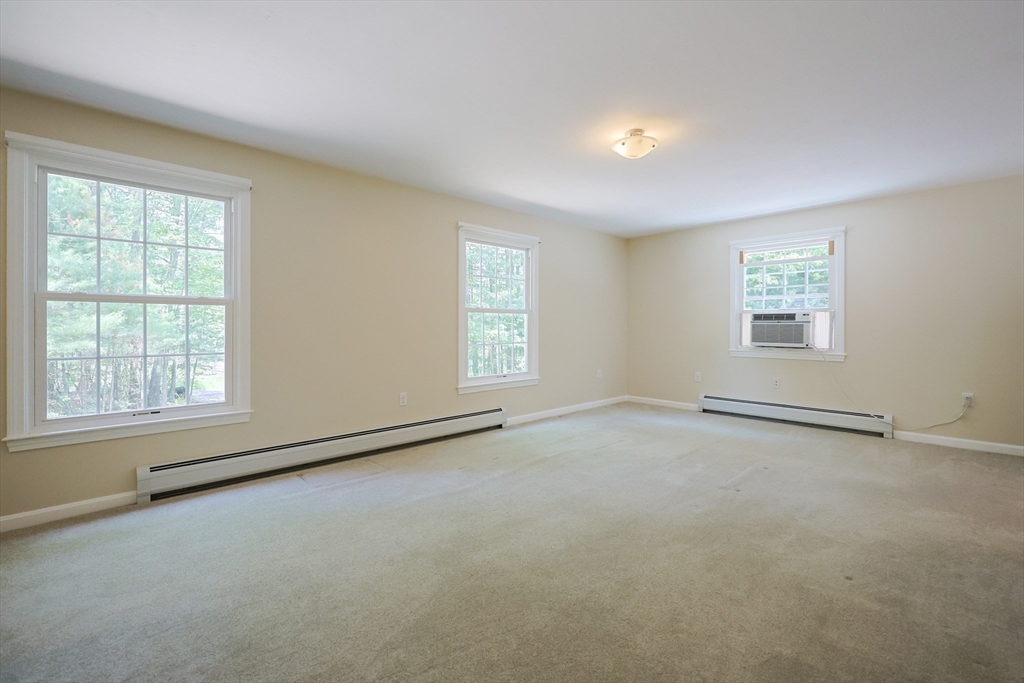 68 Dresser Hill Road, Unit 2 Dudley, MA 01571 - Photo 5 of 39 an empty room with a window