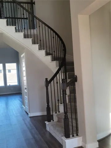 a view of entryway with wooden floor