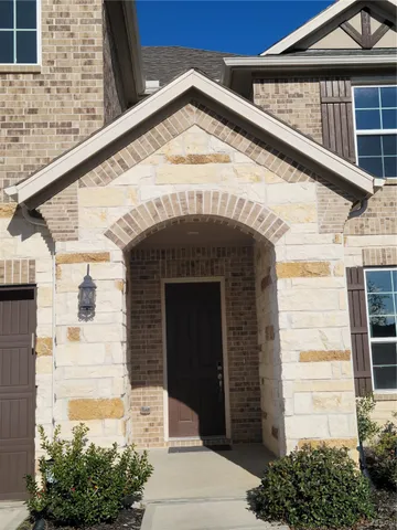 a front view of a house with a garage