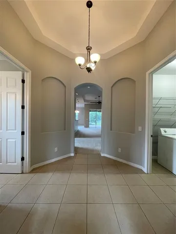 a view of empty room with ceiling fan