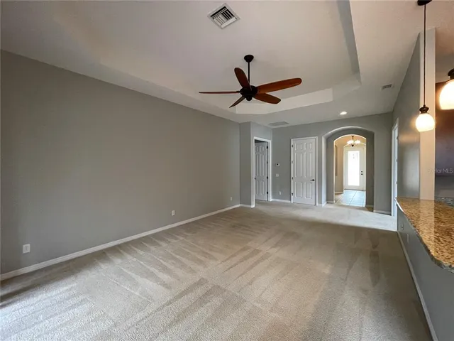 a kitchen with stainless steel appliances a refrigerator and a stove top oven