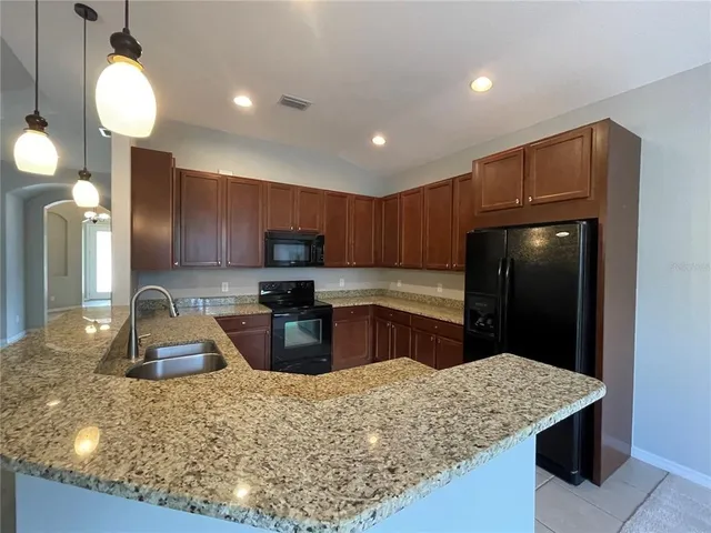 a view of a lake with houses in the back