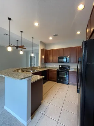 a view of a park with large trees