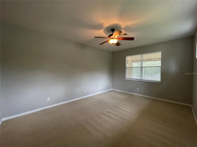 an aerial view of residential houses with outdoor space and lake view