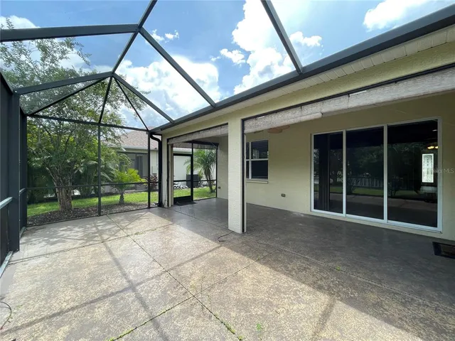 a view of a lake with a table and chairs