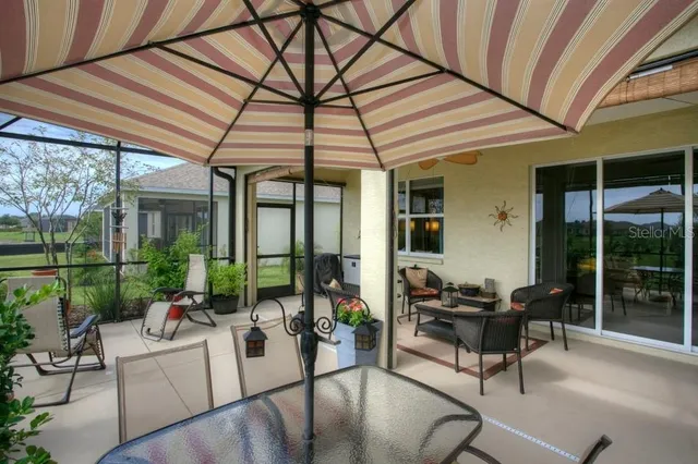 a view of a chair and table in the balcony