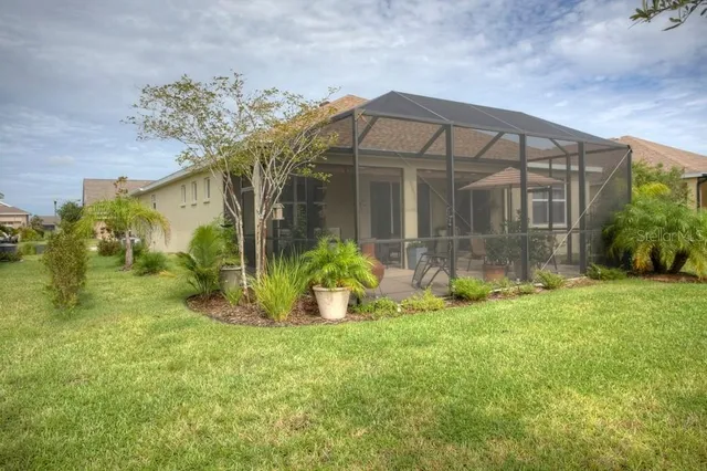 a view of a hallway with wooden floor and a hallway